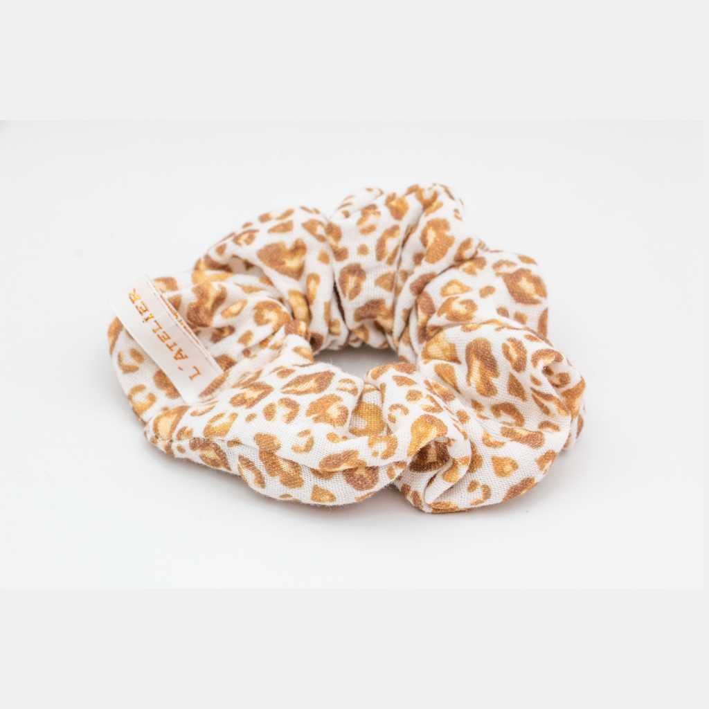 Leopard print scrunchie on a white background