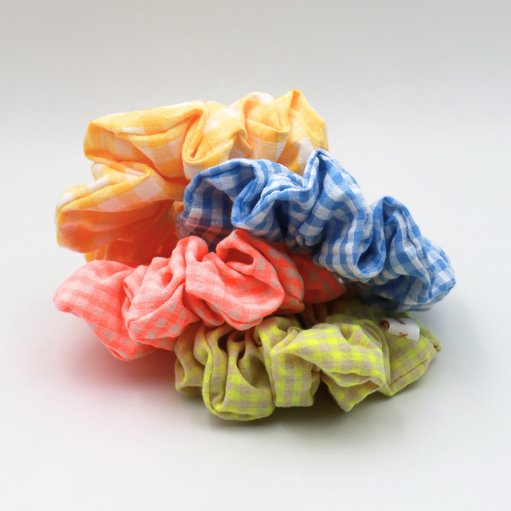 Colorful checkered scrunchies on a white background