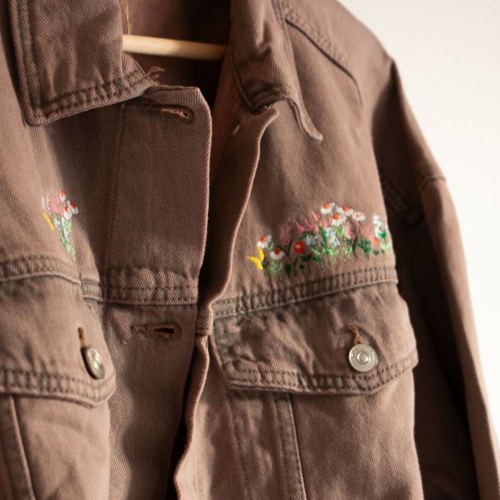 Washed Pink jacket with floral embroidery on a white background