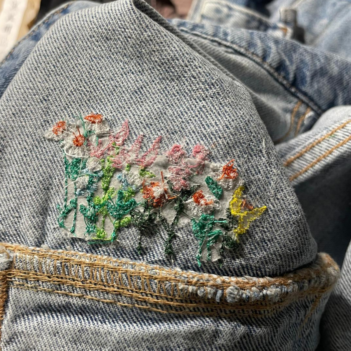 Embroidered floral design on a denim jacket