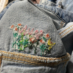 Embroidered floral design on a denim jacket